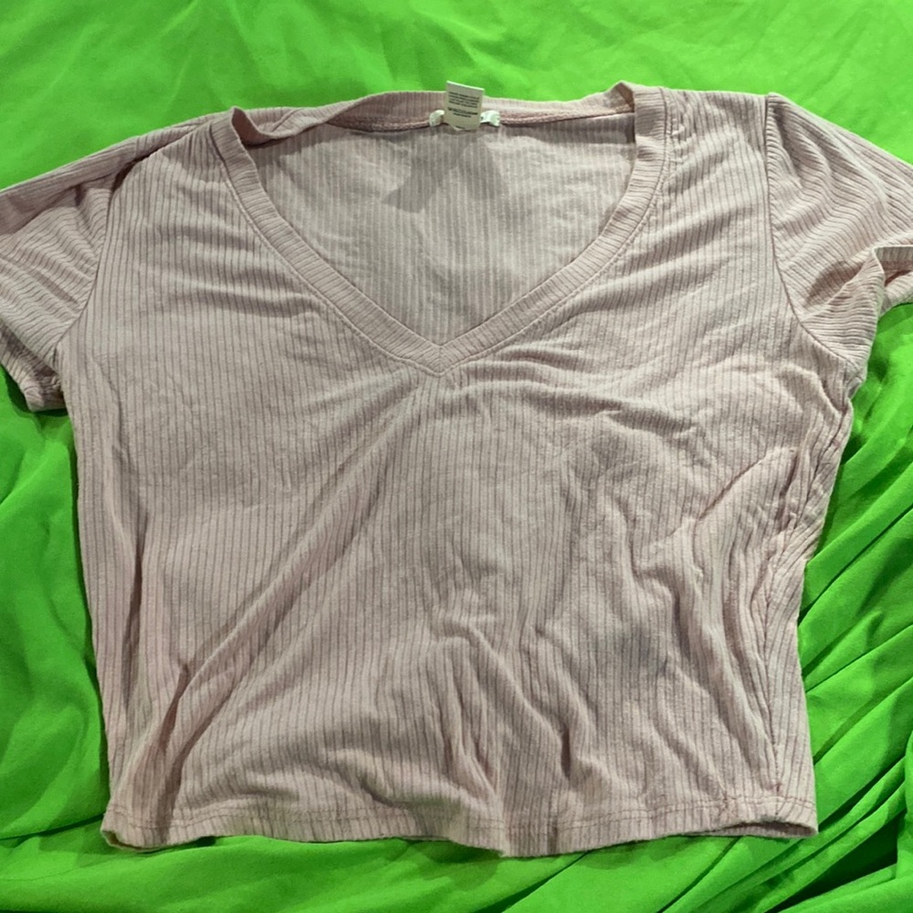 This is a pink cropped short sleeve shirt size large.